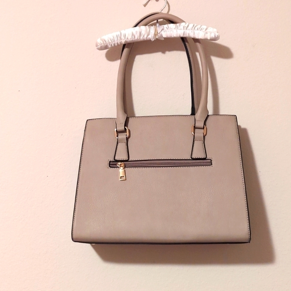 Gently used non-branded Women's Grey handbag.